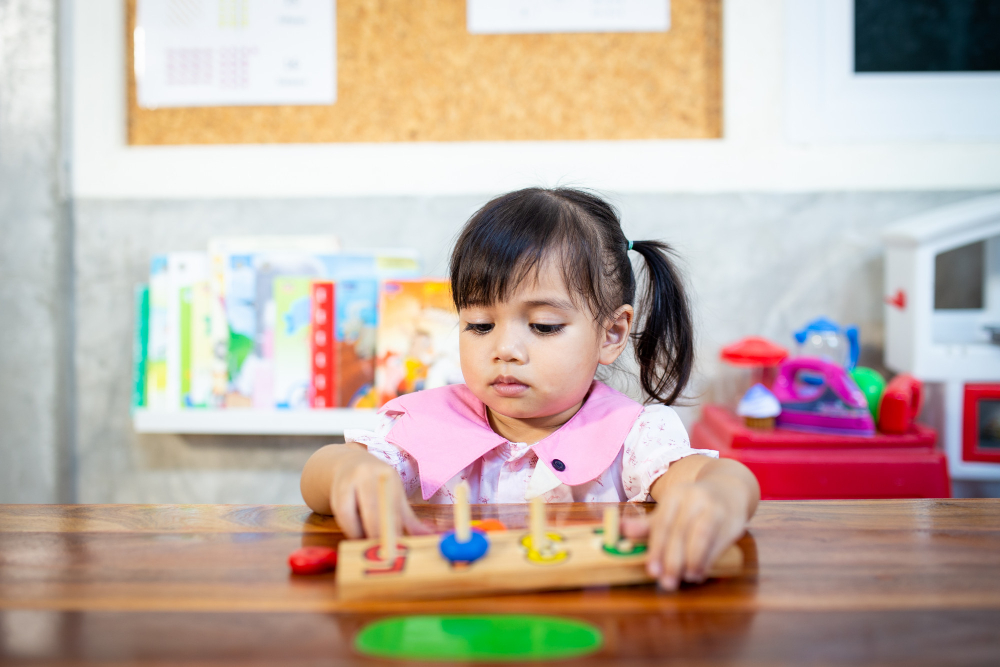 child-little-girl-playing-wooden-toys.jpg