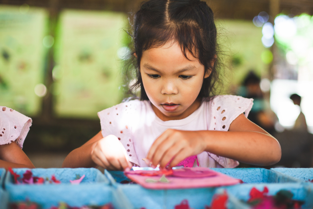 cute-asian-child-girl-make-craft-with-recycling-paper-from-poop-of-elephants.jpg